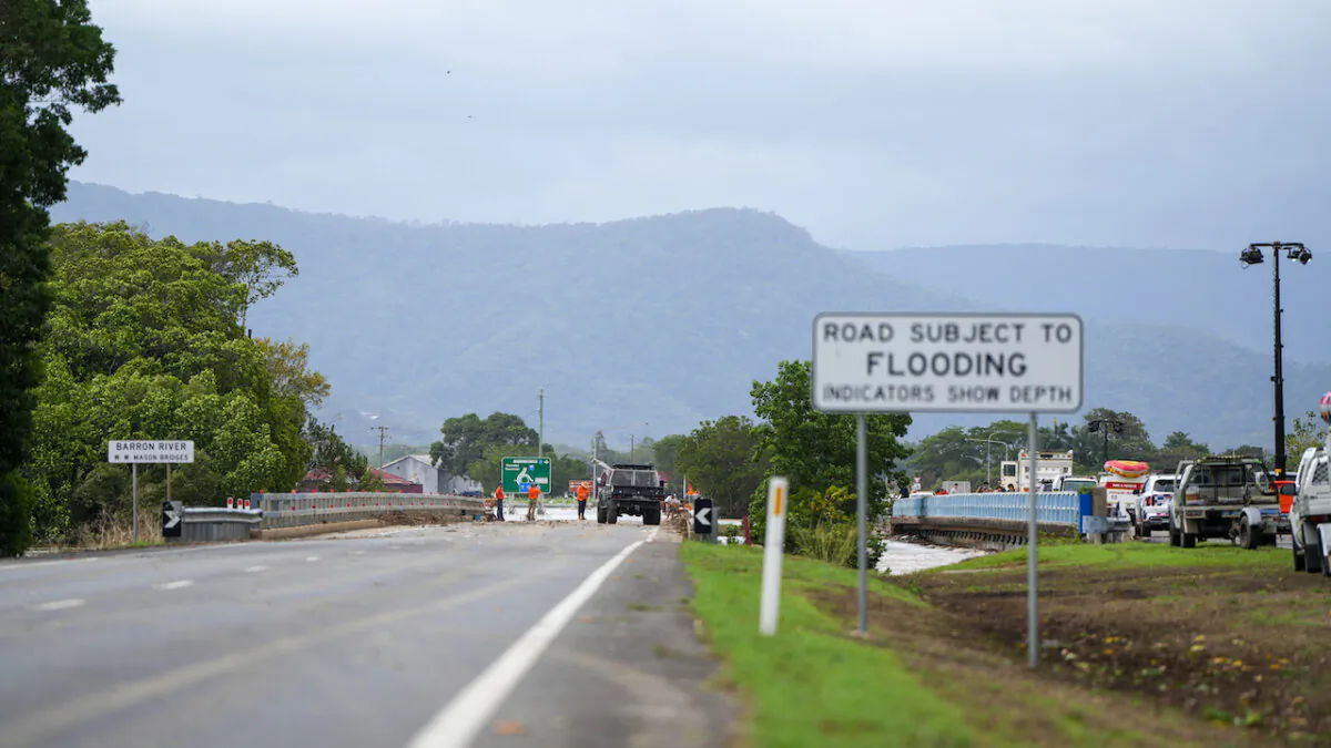 Barron Bridge along the Captain Cook Highway is closed due to flooding in Cairns in Far North Queensland on Dec. 18, 2023. (AAP Image/Nuno Avendano)