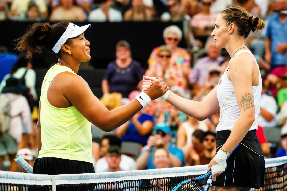 Japan's Naomi Osaka (L) shakes hands with Czech Republic's Karolína Plískova after their women's singles match at the Brisbane International tennis tournament in Brisbane on Jan. 3, 2024. (Hamilton/AFP via Getty Images)