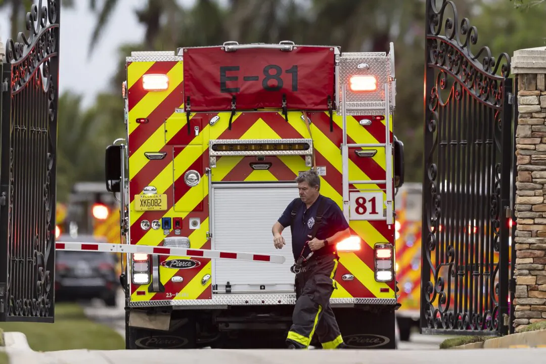 First responders work an active fire inside the Landmark Ranch Estates neighborhood in Southwest Ranches, Fla., on Jan. 3, 2024. (Matias J. Ocner/Miami Herald via AP)