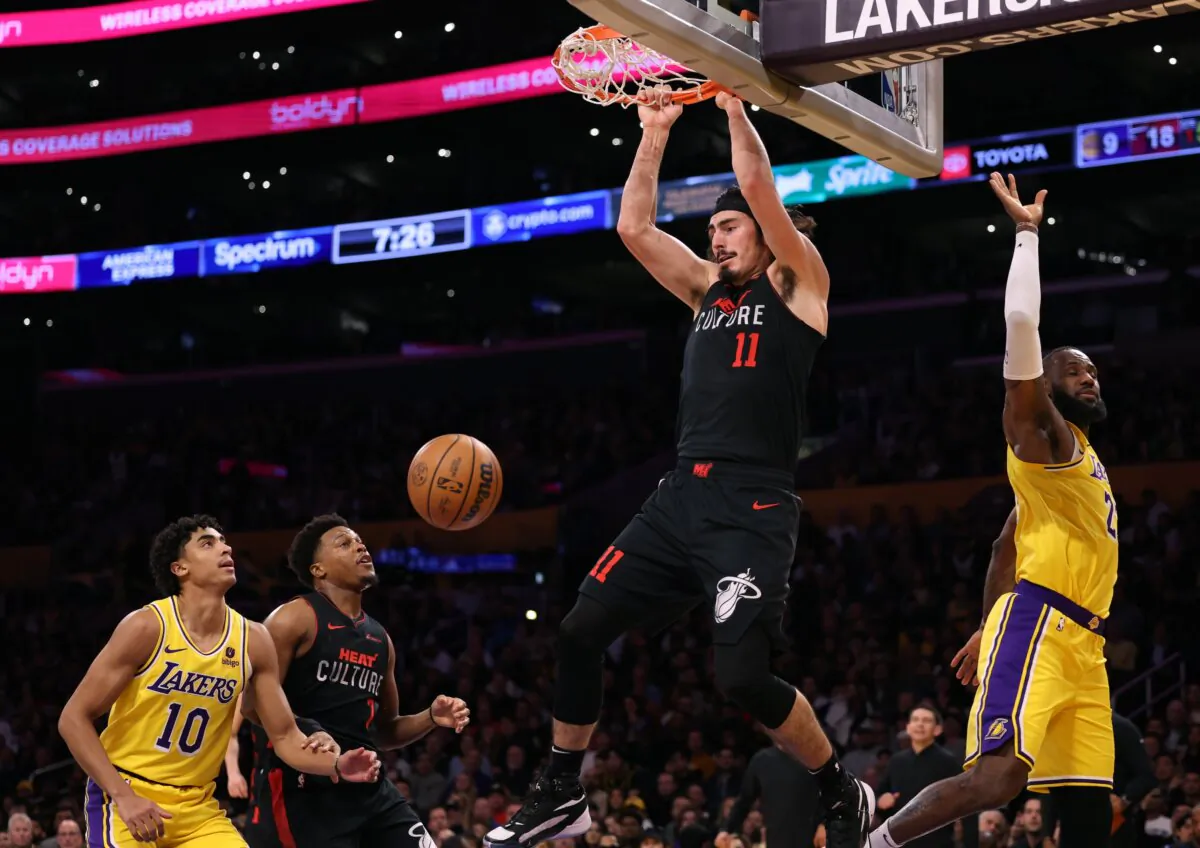 Jaime Jaquez Jr. (11) of the Miami Heat dunks past LeBron James (23) of the Los Angeles Lakers as Max Christie (10) and Kyle Lowry (7) follow during the first half in Los Angeles on Jan. 3, 2024. (Harry How/Getty Images)