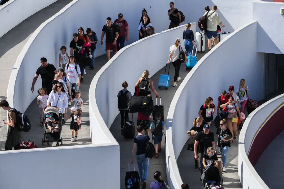 Travelers enter the El Chaparral border crossing port into the United States Customs and Border Protection (CBP) San Ysidro PedWest Port of Entry along the US-Mexico border in Tijuana, Baja California state, Mexico on April 9, 2022. (Patrick T. Fallon/AFP via Getty Images)