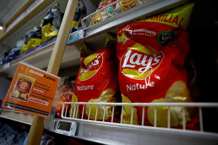 A sign reading "Shrinkflation, This product has seen its weight decrease and the price charged by our supplier increase" at a Carrefour supermarket in Montesson near Paris, France, on Sept. 13, 2023. (Sarah Meyssonnier/Reuters)