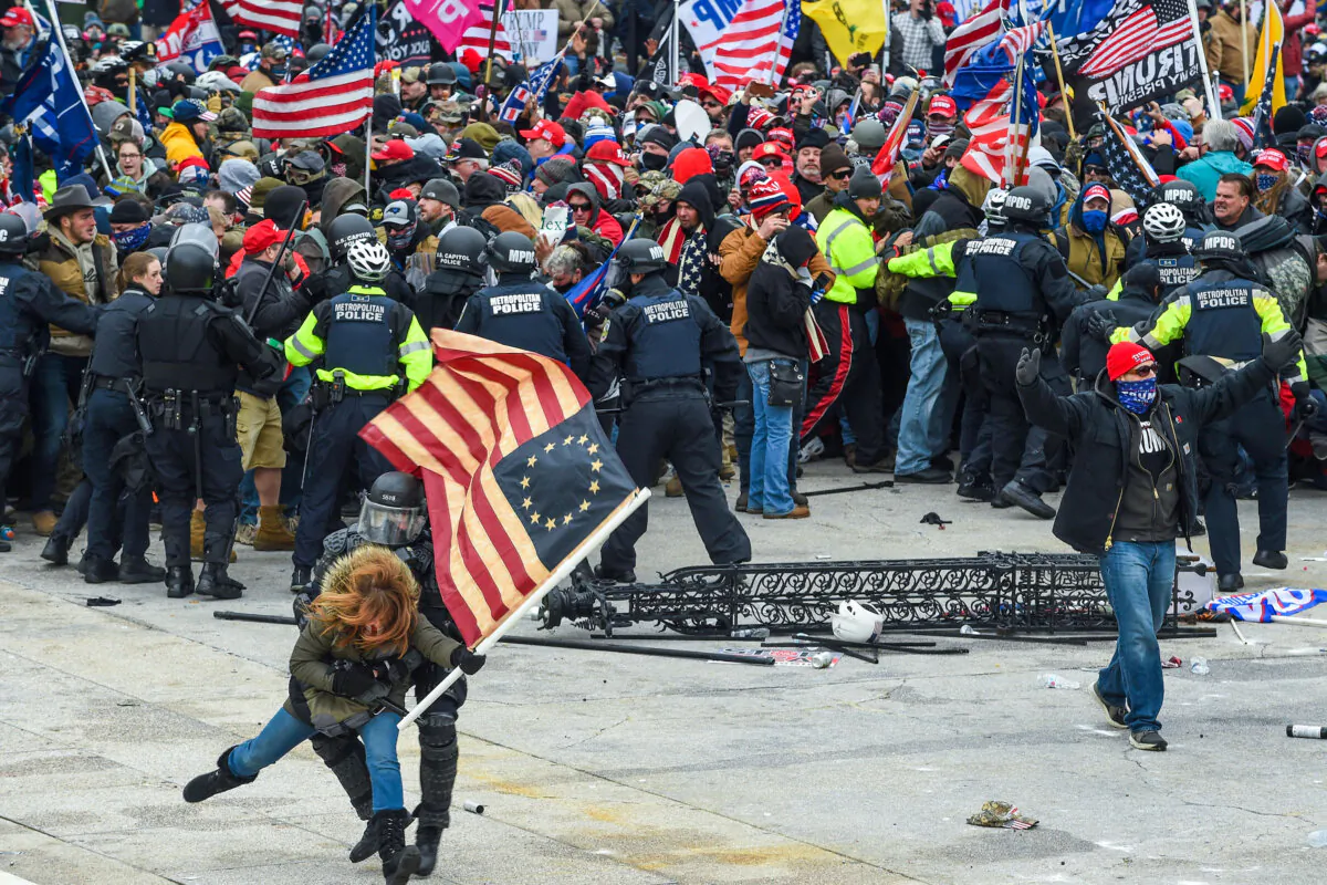 Law enforcement and protesters outside the U.S. Capitol on Jan. 6, 2021. (Roberto Schmidt/AFP via Getty Images)