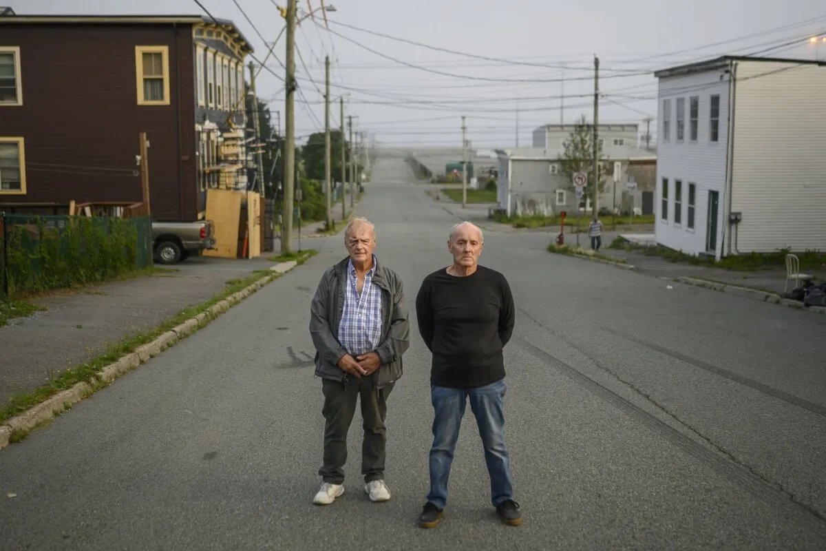 Walter Gillespie (L) and Robert Mailman pose in the south-end neighbourhood where they grew up in Saint John, N.B., on Aug. 18, 2020. (The Canadian Press/Darren Calabrese)