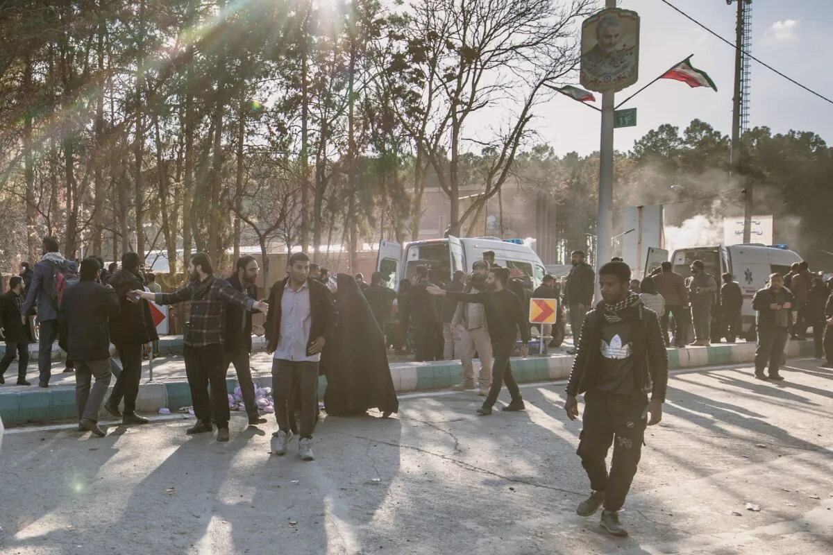 People disperse near the scene where explosions occurred in Kerman, Iran, on Jan. 3, 2024. (MAHDI/Middle East Images/AFP via Getty Images)