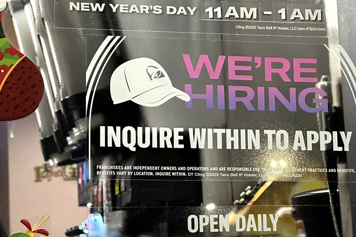 A hiring sign is displayed at a restaurant in Glenview, Ill., on Dec. 12, 2023. (Nam Y. Huh/AP Photo)