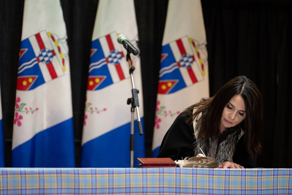 Yukon MLA Jeanie McLean signs the Oath of Office at the swearing in ceremony in the Yukon Legislature in Whitehorse on May 3, 2021. (The Canadian Press/Mark Kelly)
