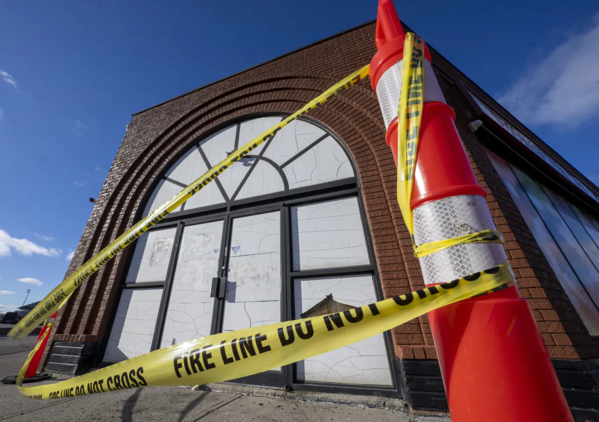 Fire tape blows in the wind outside International Delicatessen Foods in Toronto on January 4, 2024. Toronto police say a fire at a business in the city is being investigated as a suspected hate-motivated crime.
(Frank Gunn/The Canadian Press)