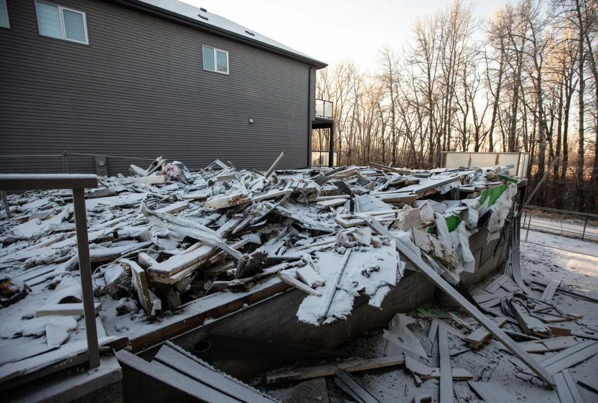 The remnants of a newly built home that was burned down and is under investigation of arson in Edmonton on Jan. 5, 2024. (The Canadian Press/Jason Franson)