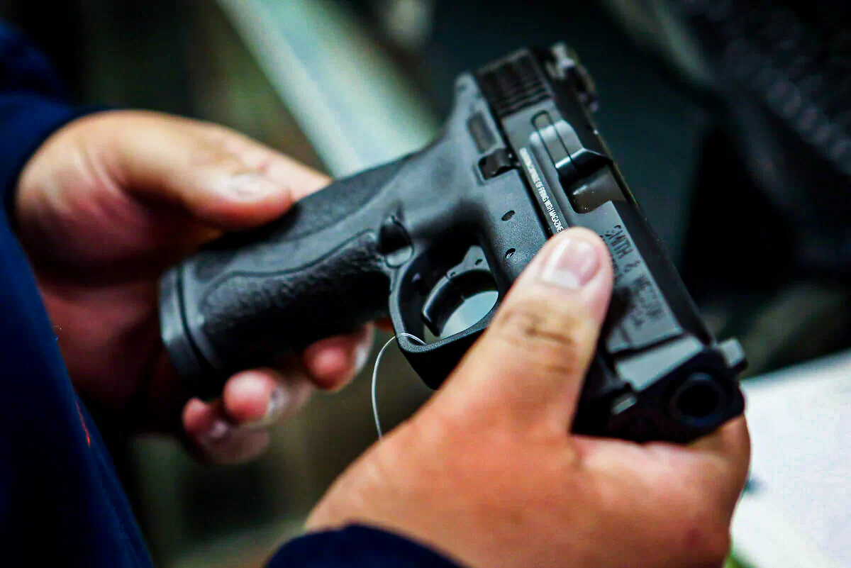 A customer shops for a pistol in Illinois in a file photograph. (Scott Olson/Getty Images)