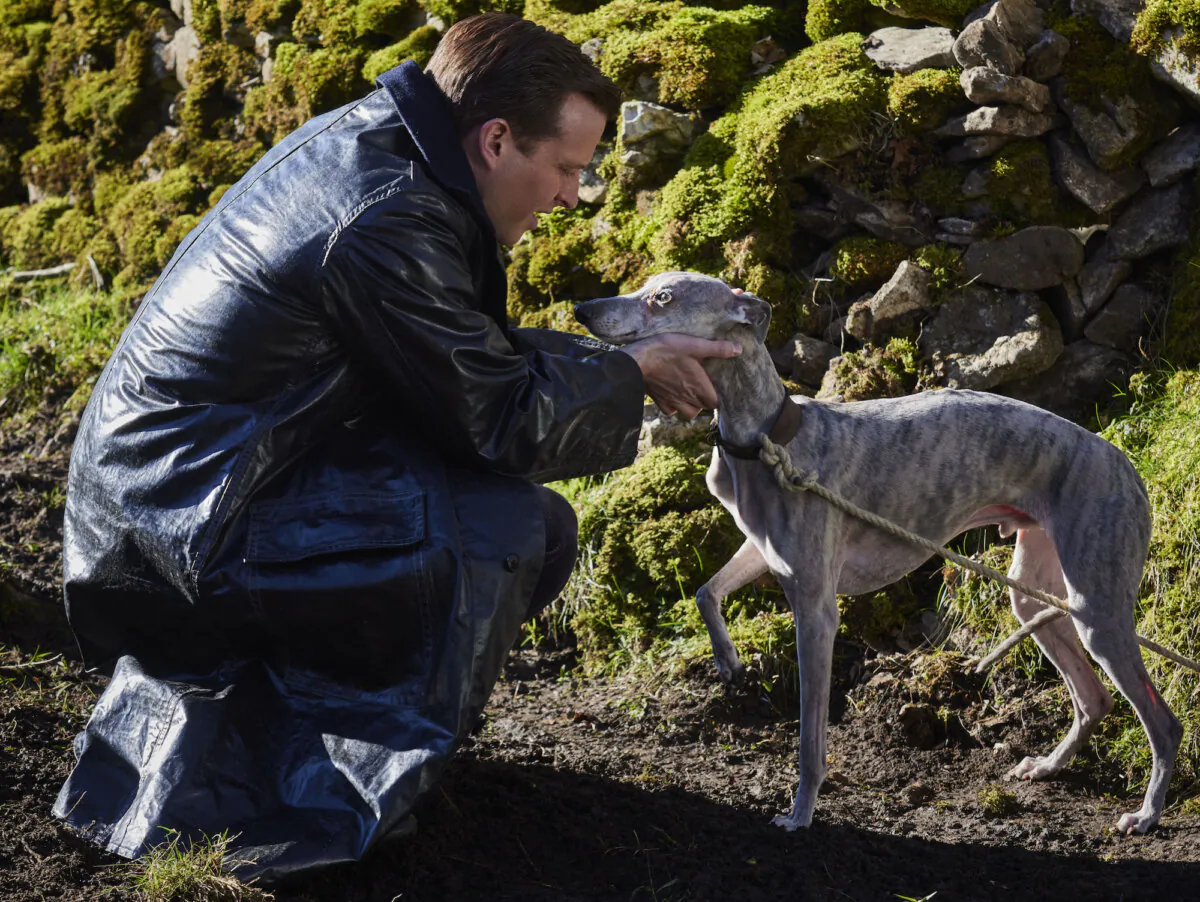 James Herriot (Nicholas Ralph) looks after a young boy's dog in “All Creatures Great and Small." (Playground Entertainment and MASTERPIECE)