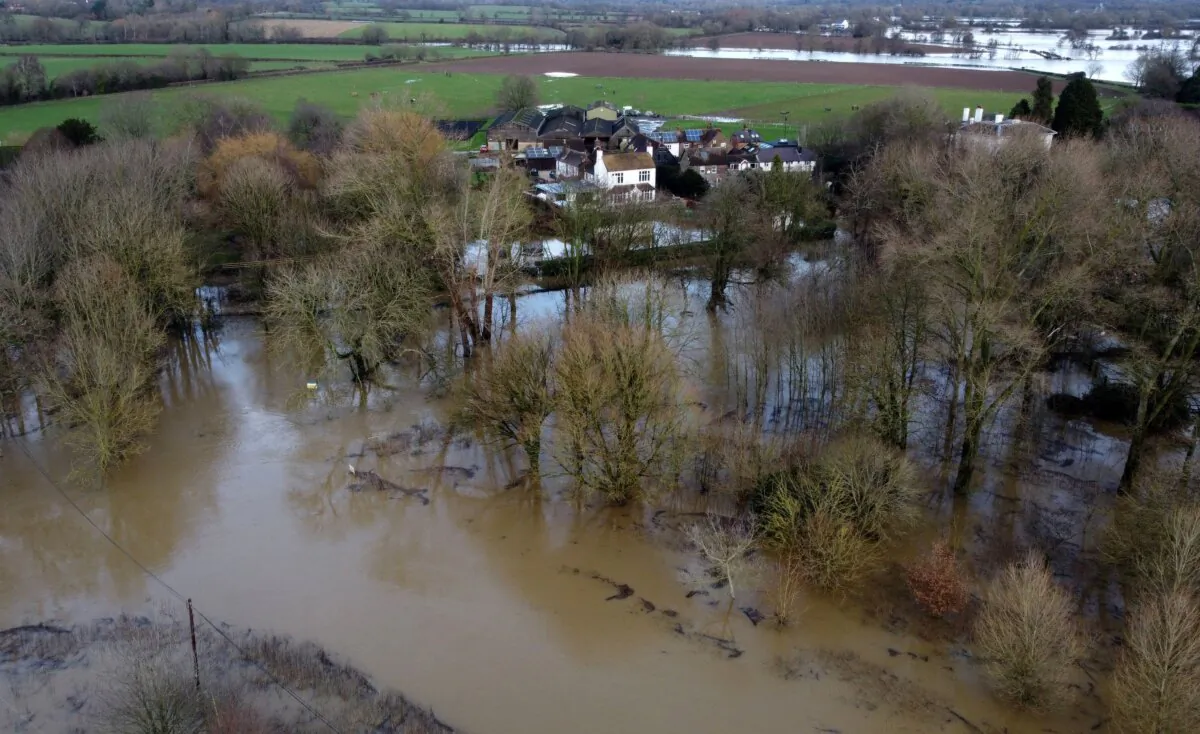 Flood waters from the River Ouse approach properties in Barcombe Mills, East Sussex, England, on Jan. 5, 2024. (Gareth Fuller/PA Wire)