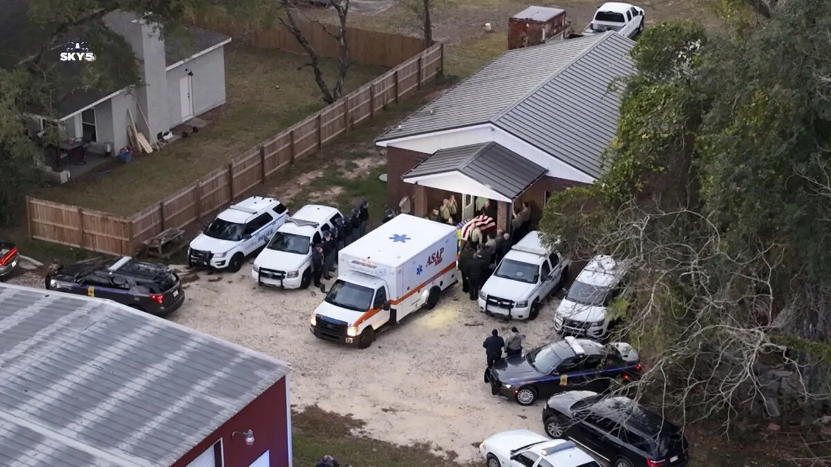 Police escort the body of George County Deputy Jeremy Malone from the George County Courthouse to the Mississippi Forensics Lab in Biloxi on Jan. 5, 2024. (WKRG-TV via AP)