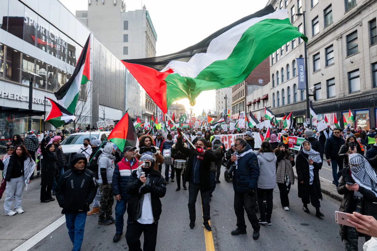 Pro-Palestinian protesters are seen during a protest in downtown Ottawa on Nov. 25, 2023. (The Canadian Press/Spencer Colby