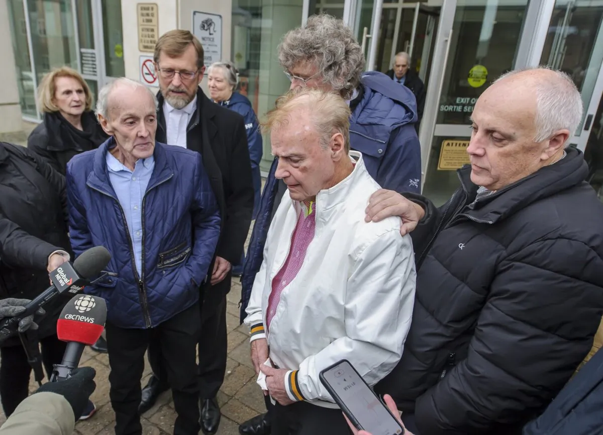 Robert Mailman (L) and Walter Gillespie speak to media as Ron Dalton (R) co-president of Innocence Canada, looks on after their hearing at Saint John Law Courts in Saint John, N.B., on Jan. 4, 2024. (The Canadian Press/Michael Hawkins)