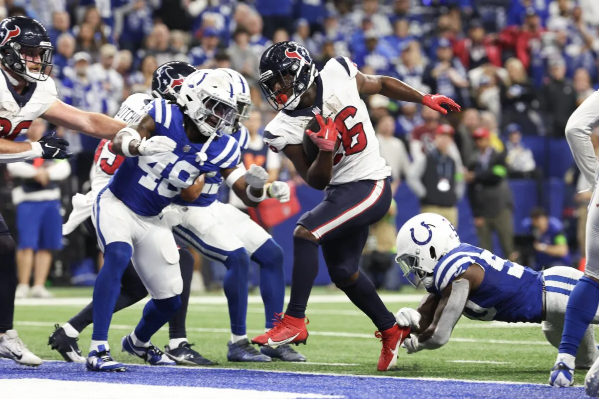 Devin Singletary (26) of the Houston Texans runs for a touchdown during the fourth quarter against the Indianapolis Colts in Indianapolis on Jan. 6, 2024. (Michael Hickey/Getty Images)