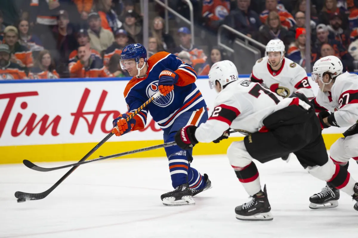 Zach Hyman (18) of the Edmonton Oilers skates against Thomas Chabot (72) of the Ottawa Senators during the third period at Rogers Place in Edmonton, Canada, on Jan. 6, 2024. (Codie McLachlan/Getty Images)