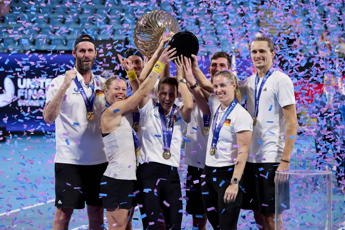 Team Germany poses for a photo with the United Cup Trophy after victory against Poland during the 2024 United Cup at Ken Rosewall Arena, in Sydney, Australia, on Jan. 7, 2024. (Brett Hemmings/Getty Images)