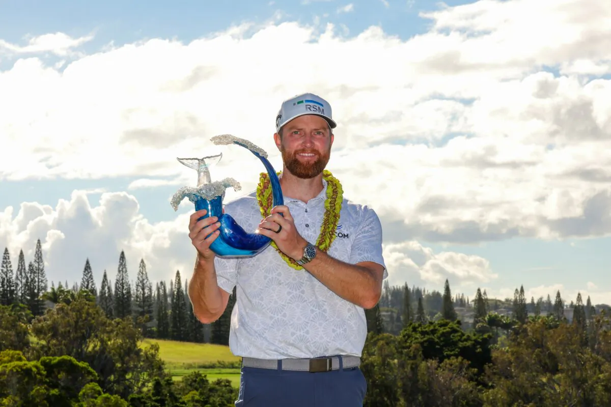 Chris Kirk of the United States celebrates with the trophy after winning the final round of The Sentry at Plantation Course at Kapalua Golf Club in Kapalua, Hawaii, on Jan. 7, 2024. (Kevin C. Cox/Getty Images)
