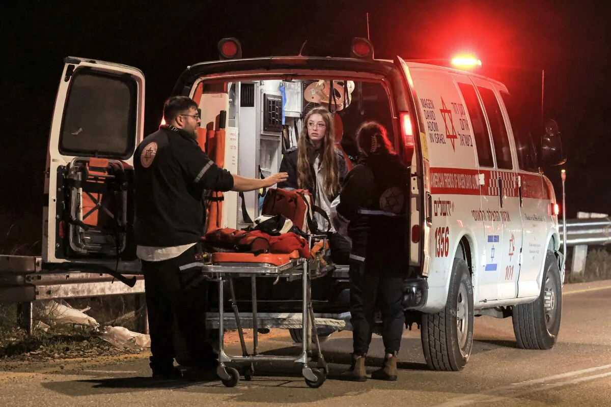 An ambulance is deployed at the scene of a reported car-ramming attack at the Ras Bidu checkpoint near the Israeli settlement of Givat Zeev, between Jerusalem and Ramallah in the occupied West Bank, on Jan. 7, 2024. (Ahmad Gharabli/AFP via Getty Images)