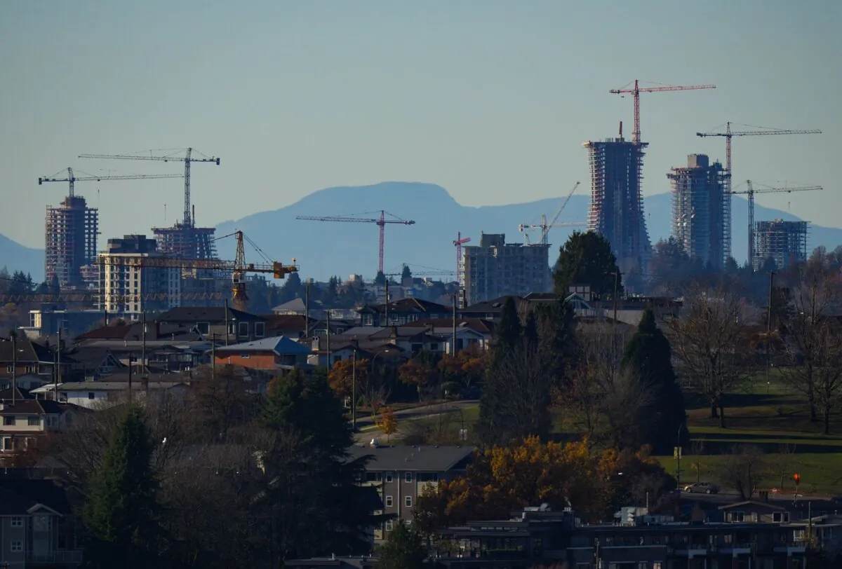 Construction cranes dot the skyline as condo towers are seen under construction at the Oakridge Park shopping centre redevelopment, in Vancouver, B.C., on Nov. 23, 2023. (The Canadian Press/Darryl Dyck)