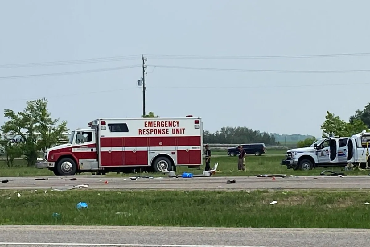 Emergency crews respond to the scene that closed a section of the Trans-Canada Highway near Carberry, Man., on June 15, 2023. (The Canadian Press/Steve Lambert)