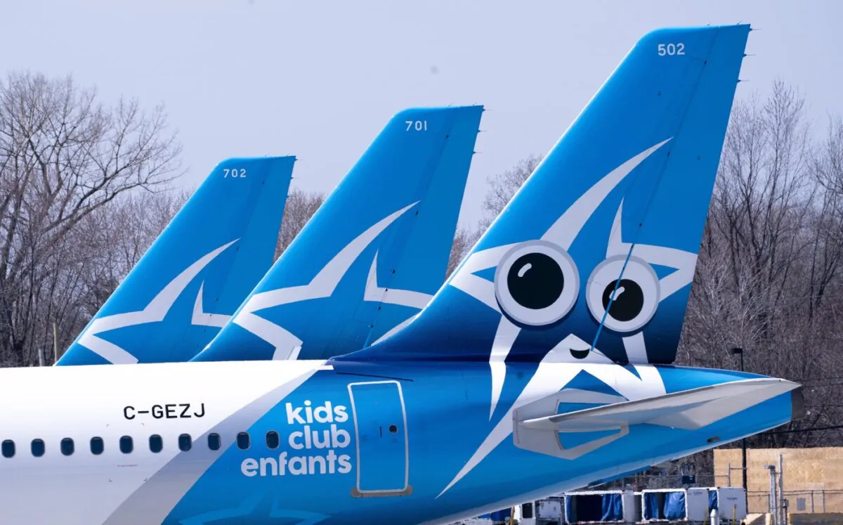 Air Transat palnes are seen on the tarmac at Montreal-Trudeau International Airport in Montreal, on April 8, 2020. (The Canadian Press/Paul Chiasson)
