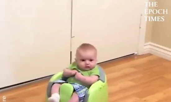 Cute Baby Rides a Robot Vacuum Cleaner