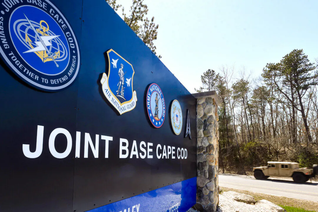 Some migrants reportedly are also being housed at Joint Base Cape Cod, home of the 102nd Intelligence Wing and Otis Air National Guard Base, in Hyannis, Mass. A vehicle approaches the gate on April 13, 2023. (Steve Heaslip/USA Today Network via Reuters)