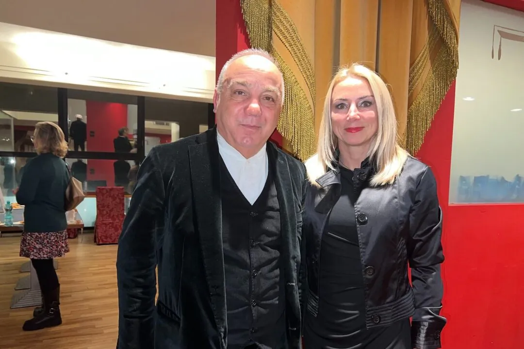 Giovanni Chessa and a friend at the Shen Yun Performing Arts performance at Teatro Lirico, in Italy on Jan. 5, 2024. (Shi Ping/The Epoch Times)