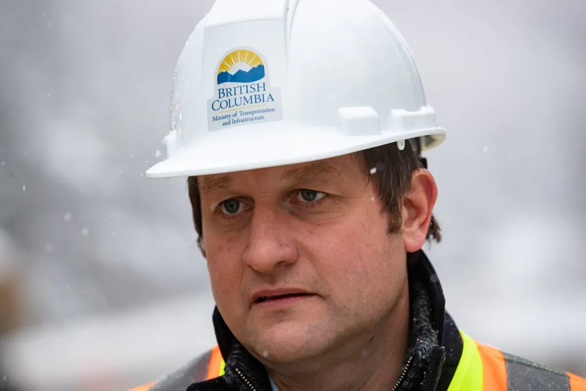 B.C. Minister of Transportation Rob Fleming views flooding and mudslide repair and clean up progress on the Coquihalla Highway northeast of Hope, B.C., on Dec. 10, 2021. (The Canadian Press/Darryl Dyck)