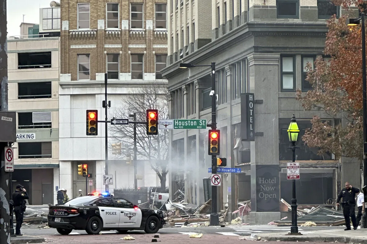 First responders work the scene after an explosion at the Sandman Signature hotel on Monday, Jan. 8, 2024, in Fort Worth, Texas. (Cameron Arnold via AP)