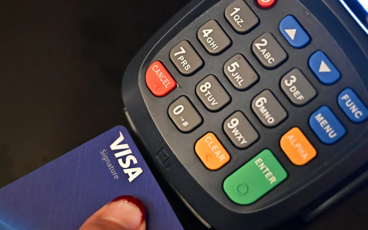 A credit card is placed into a credit card machine for processing payments in La Puente, California, on Sept. 11, 2023. (Frederic J. Brown/AFP via Getty Images)