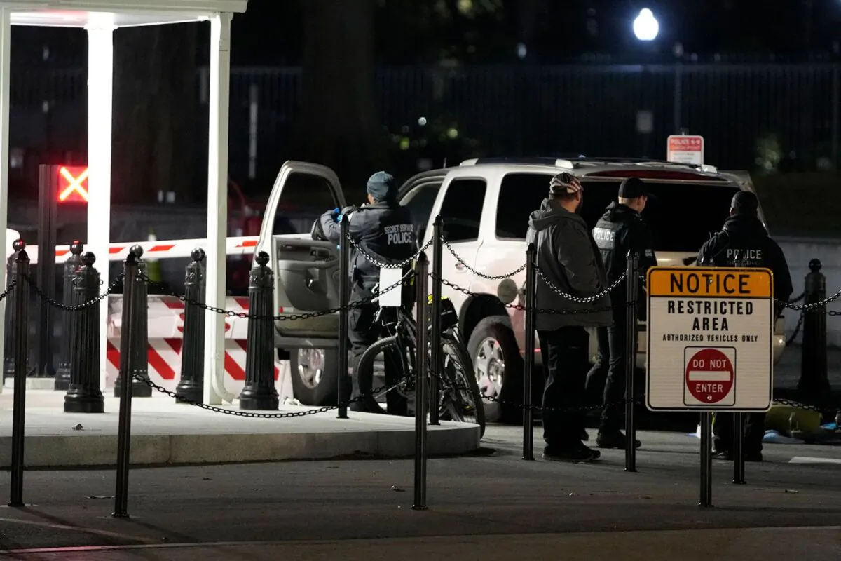 U.S. Secret Service police investigate a vehicle that hit a security barrier at an entry point for the White House complex in Washington, D.C., on Jan. 8, 2024. (Mark Schiefelbein/AP)