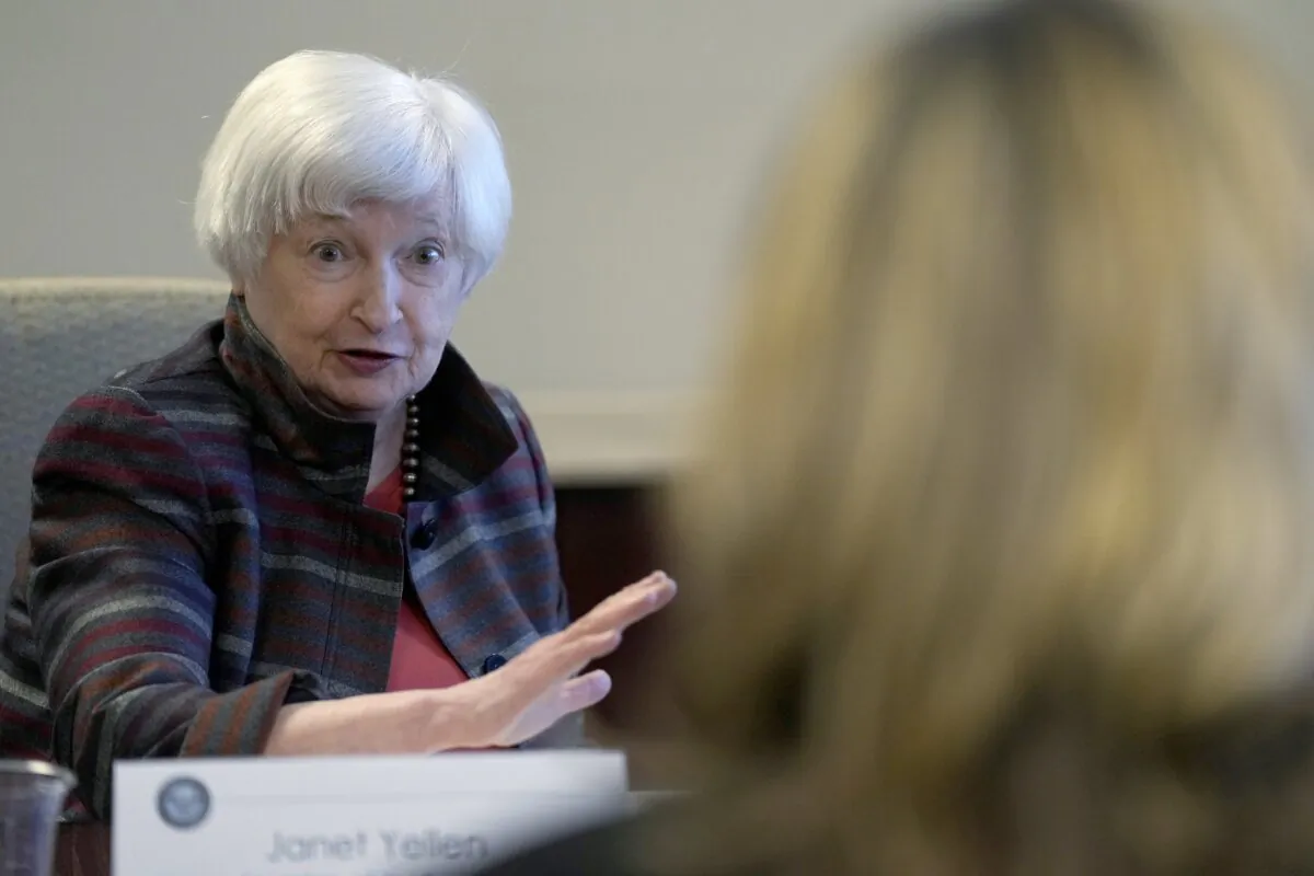 Treasury Secretary Janet Yellen asks a question during a visit to the Financial Crimes Enforcement Network (FinCEN) in Vienna, Va., on Jan. 8, 2024. (Susan Walsh/AP Photo)