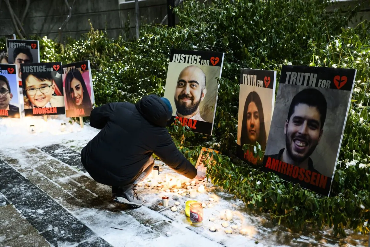Members of the Iranian community gather and grieve on the fourth anniversary of the downing of Ukraine International Airlines Flight PS752, in Toronto on Jan. 7, 2024. (The Canadian Press/Christopher Katsarov)