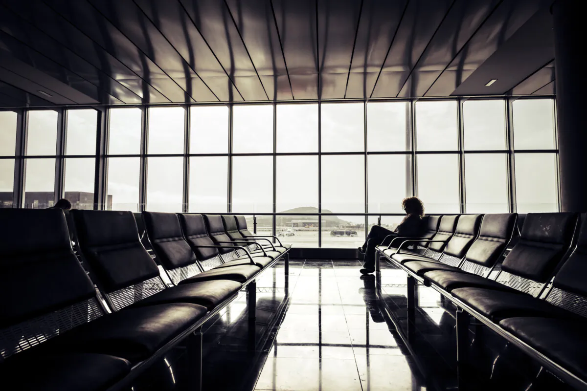 A stranded passenger due to a cancelled flight. (Dreamstime/TNS)