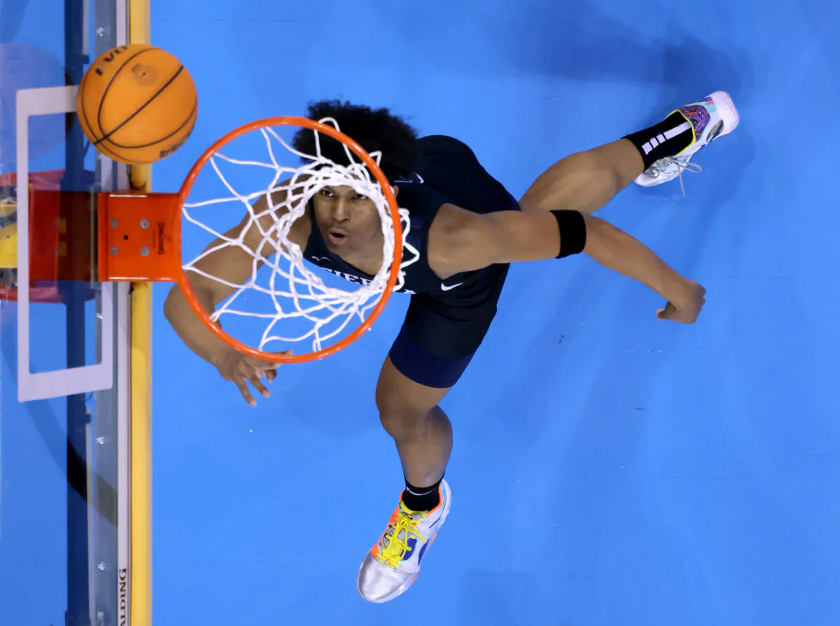 A high school basketball player scores on a layup at a game at the University of California–Los Angeles Pauley Pavilion in Los Angeles on Jan. 27, 2023. (Harry How/Getty Images)