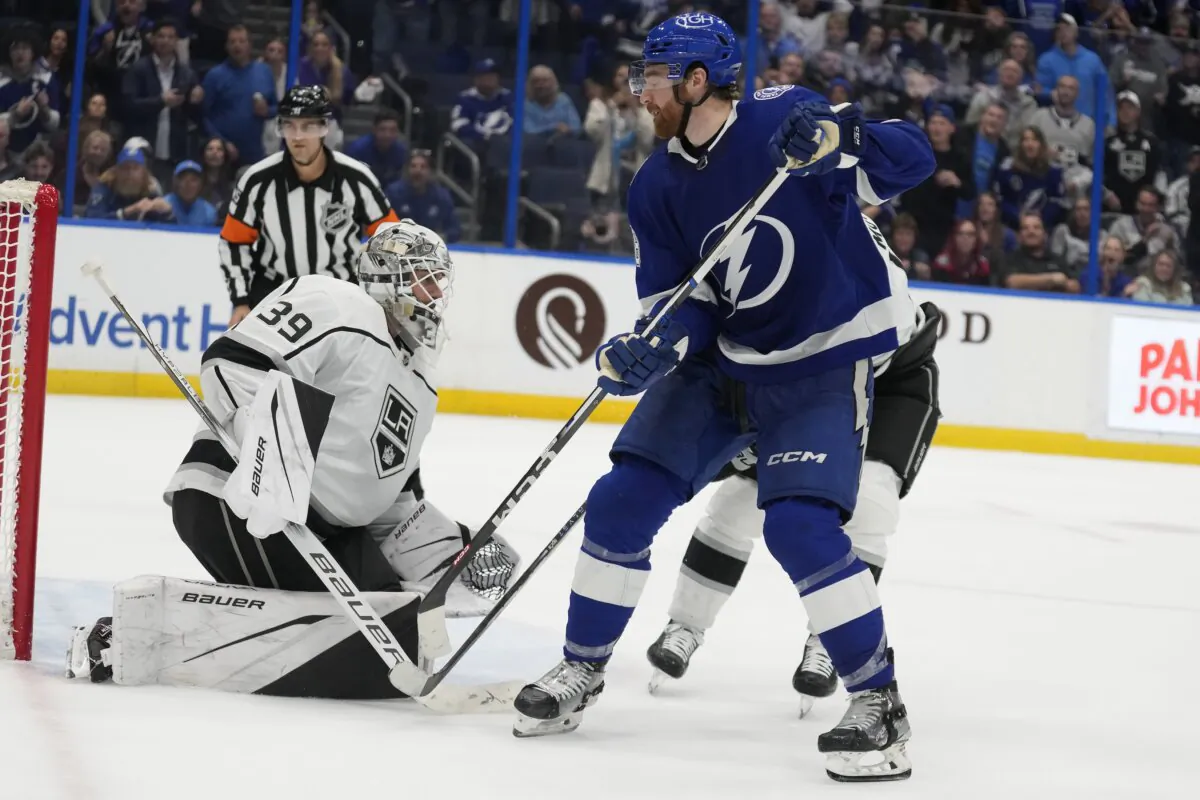 Tampa Bay Lightning defenseman Nick Perbix (48) catches his shot get past Los Angeles Kings goaltender Cam Talbot (39) for a goal during overtime in an NHL hockey game in Tampa, Fla., on Jan. 9, 2024. (Chris O'Meara/AP Photo)