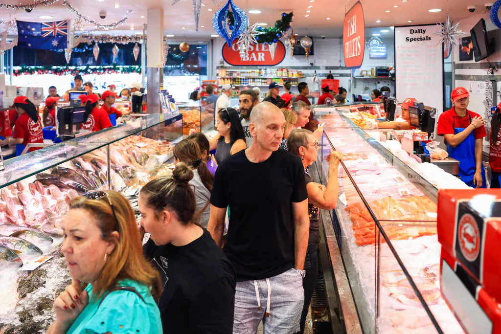 Consumers select seafood at Sydney Fish Market in Sydney, Australia, on Dec. 23, 2023. (Jenny Evans/Getty Images)