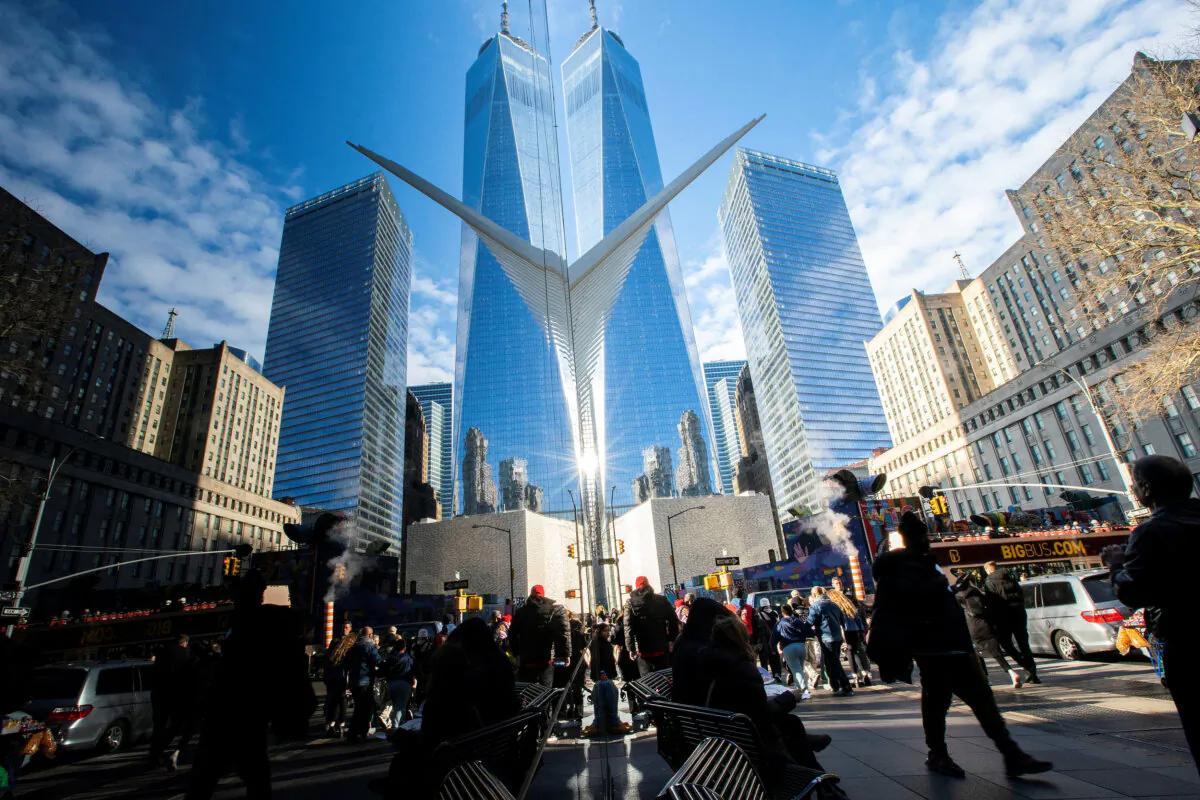 People walk around the Financial District near the New York Stock Exchange (NYSE) in New York on Dec. 29, 2023. (Eduardo Munoz/Reuters)