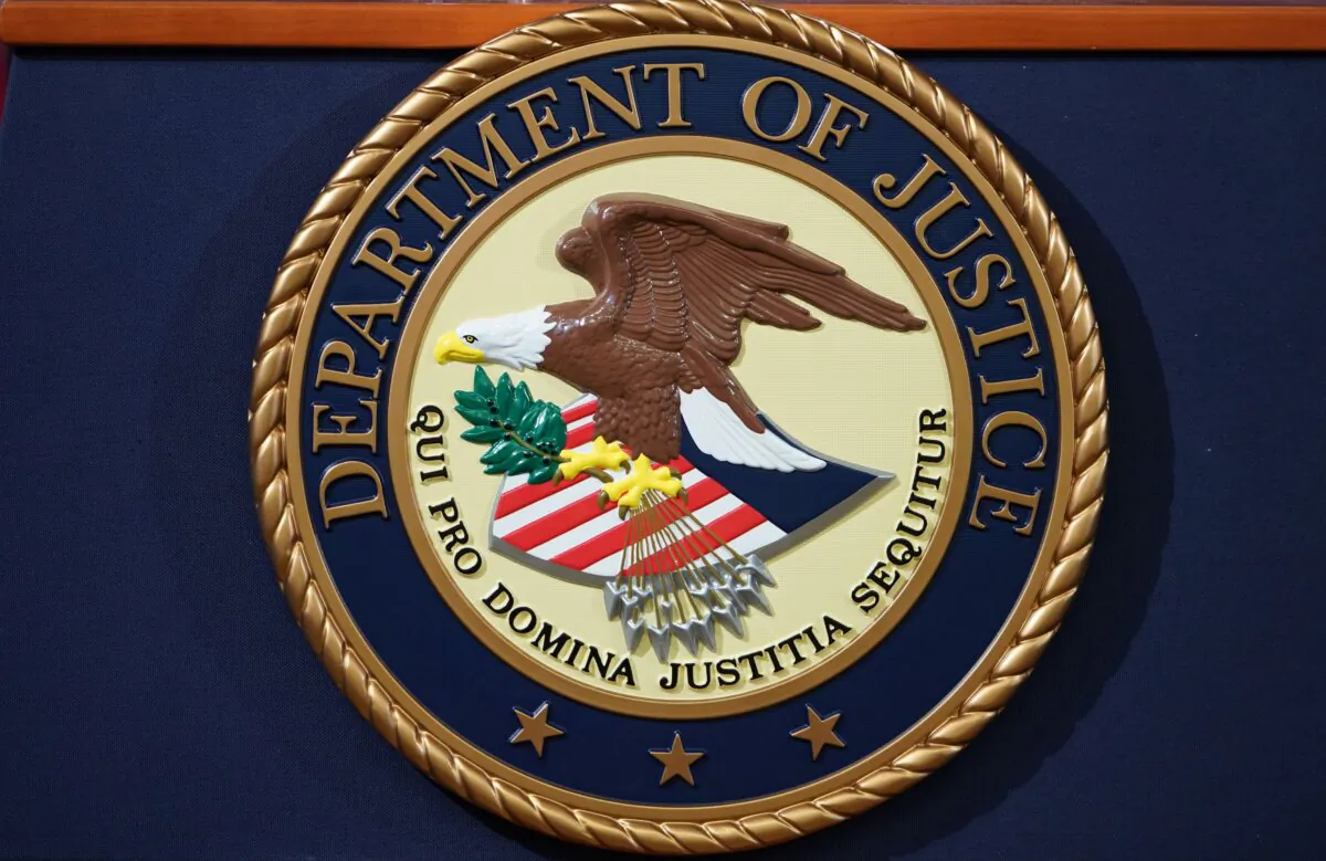The Department of Justice seal is seen on a lectern ahead of a press conference in Washington, D.C., on Nov. 28, 2018. (Mandel Ngan/AFP via Getty Images)