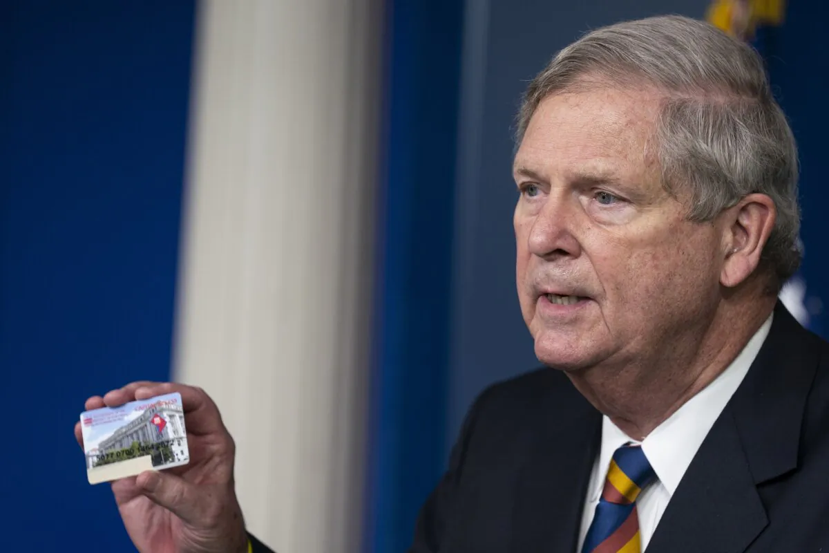 Agriculture Secretary Tom Vilsack holds up a Supplemental Nutrition Assistance Program Electronic Benefits Transfer (SNAP EBT) card during a news conference at the White House on May 5, 2021. (Evan Vucci/AP Photo)