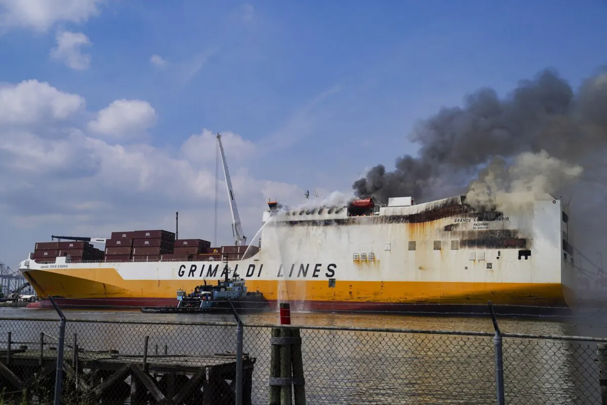 Emergency personnel battle against a fire aboard the Italian-flagged Grande Costa d'Avorio cargo ship at the Port of Newark in Newark, N.J., on July 7, 2023. (John Minchillo/AP Photo)
