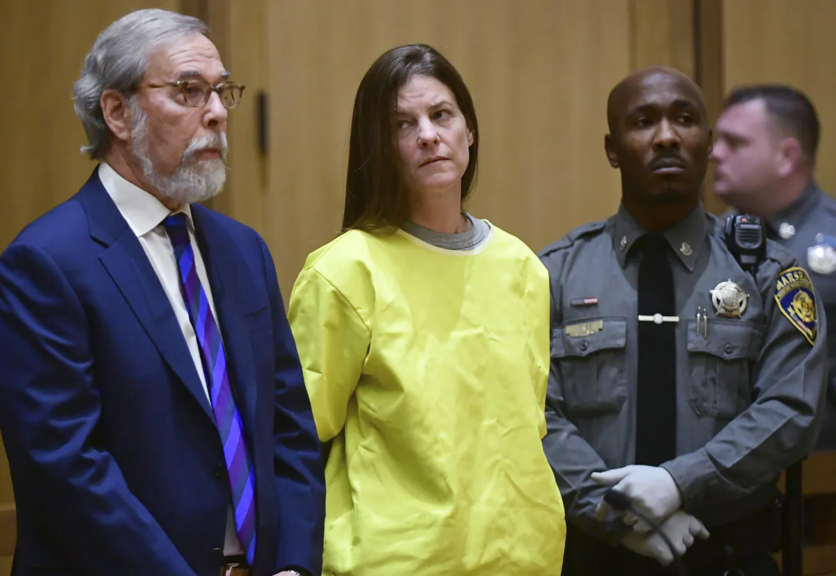 Michelle Troconis (C) is arraigned on conspiracy to commit murder charges in Stamford Superior Court in Stamford, Conn., on Jan. 8, 2020. (Erik Trautmann/Hearst Connecticut Media via AP, Pool)