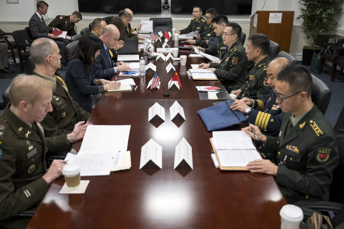 Deputy Assistant Secretary of Defense for China, Taiwan, and Mongolia Michael Chase hosts delegates from China for the annual U.S.-PRC Defense Policy Coordination Talks at the Pentagon on Jan. 9, 2024. (Petty Officer 1st Class Alexander Kubitza/U.S. Navy via AP)