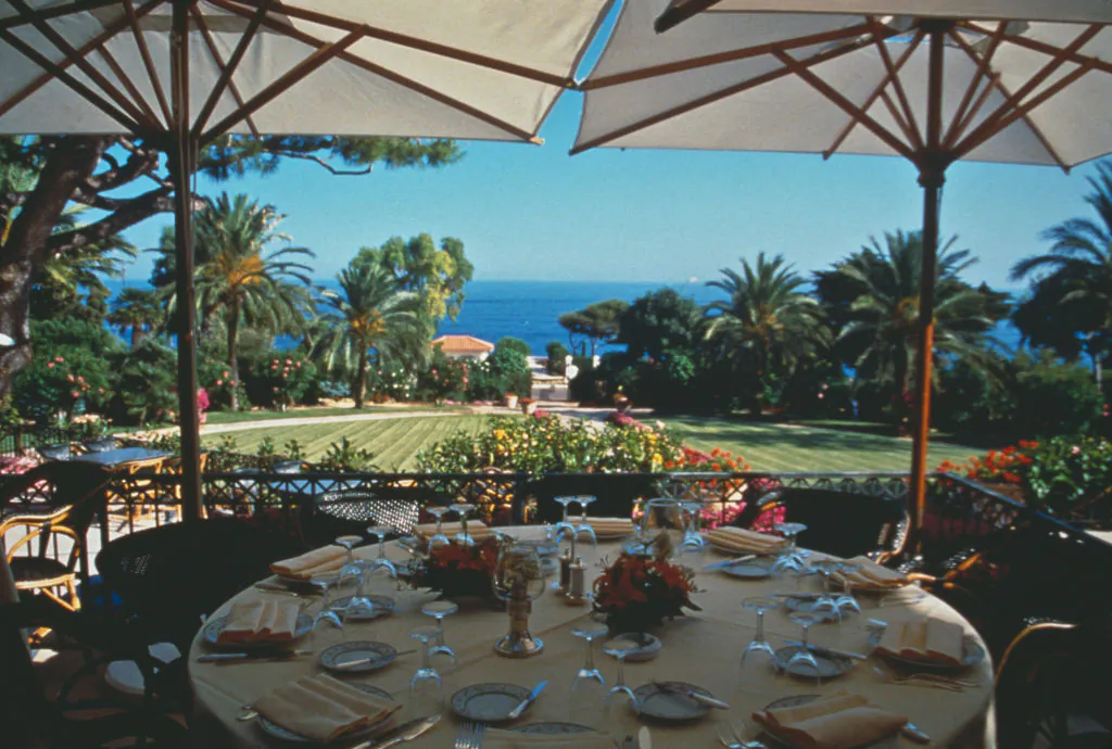 A laid table overlooking the coast at the Grand Hotel du Cap Ferrat at Saint-Jean-Cap-Ferrat in southeastern France, circa 1965. (Archive Photos/Getty Images)