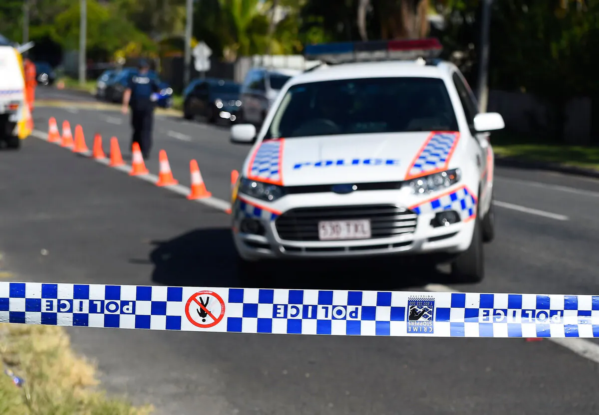 A police vehicle and tape in Cairns, Australia, on Dec. 19, 2014. (Ian Hitchcock/Getty Images)