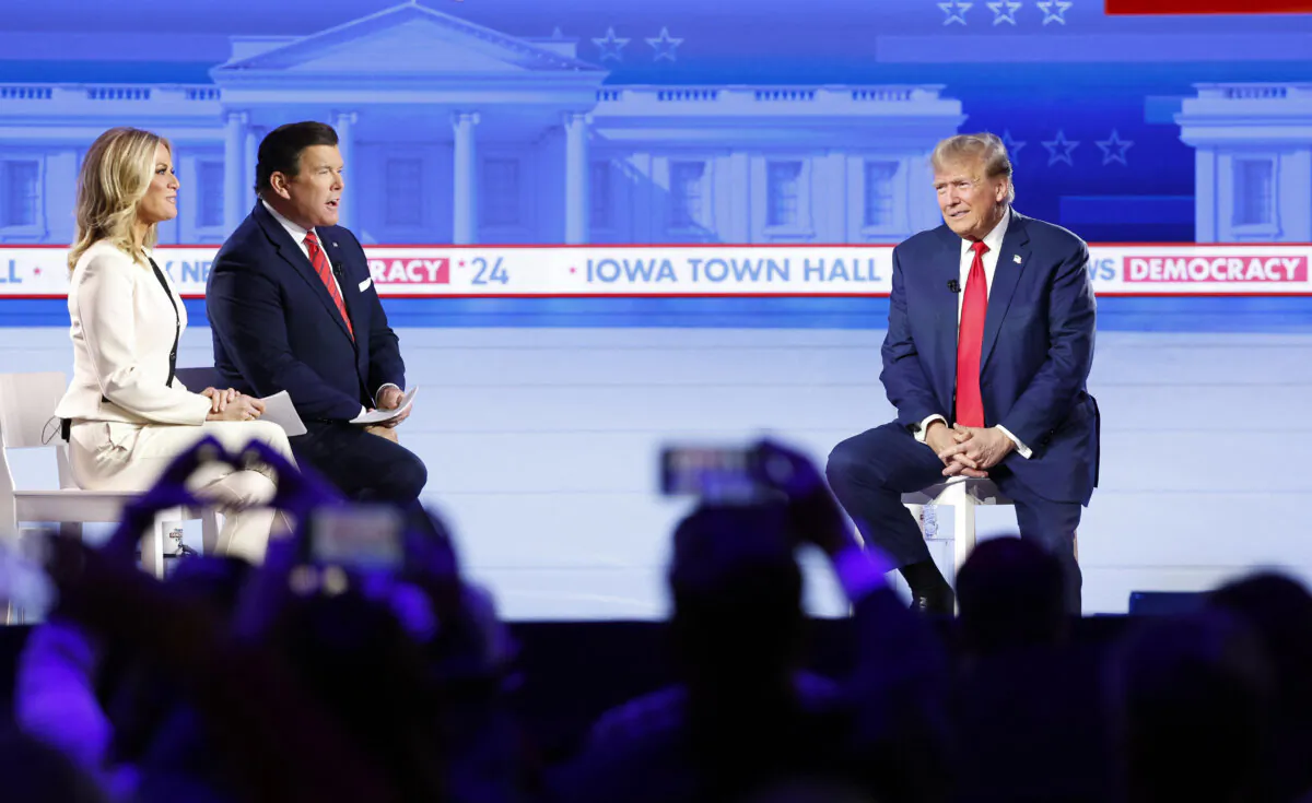 Former President and 2024 Republican presidential hopeful Donald Trump speaks as moderators Bret Baier and Martha MacCallum look on during a town hall in Des Moines, Iowa, on Jan. 10, 2024. (Kamil Krzaczynski/AFP via Getty Images)