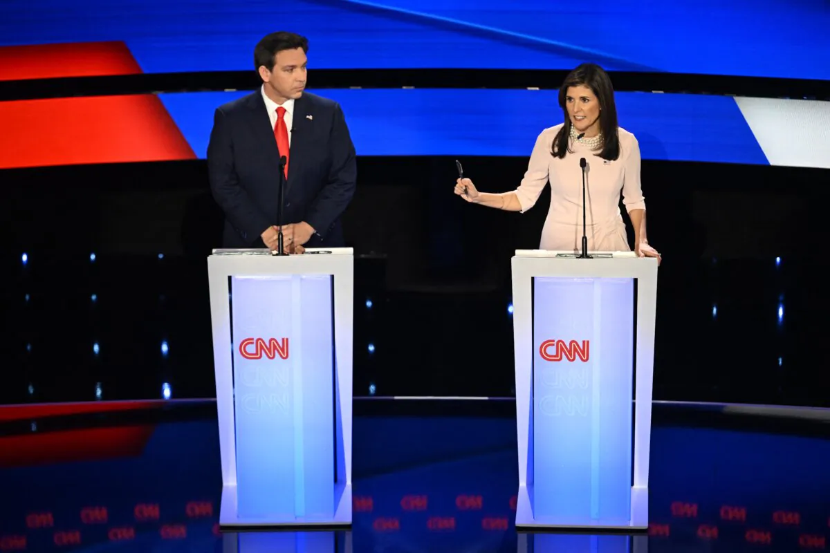 Florida Gov. Ron DeSantis and former U.S. Ambassador to the U.N. Nikki Haley speak during the fifth Republican presidential primary debate at Drake University in Des Moines, Iowa, on Jan. 10, 2024. (Jim Watson/AFP via Getty Images)